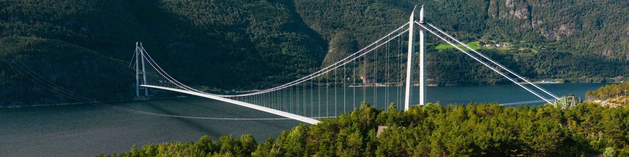 Hardanger Bridge - suspension bridge between two mountain slopes.