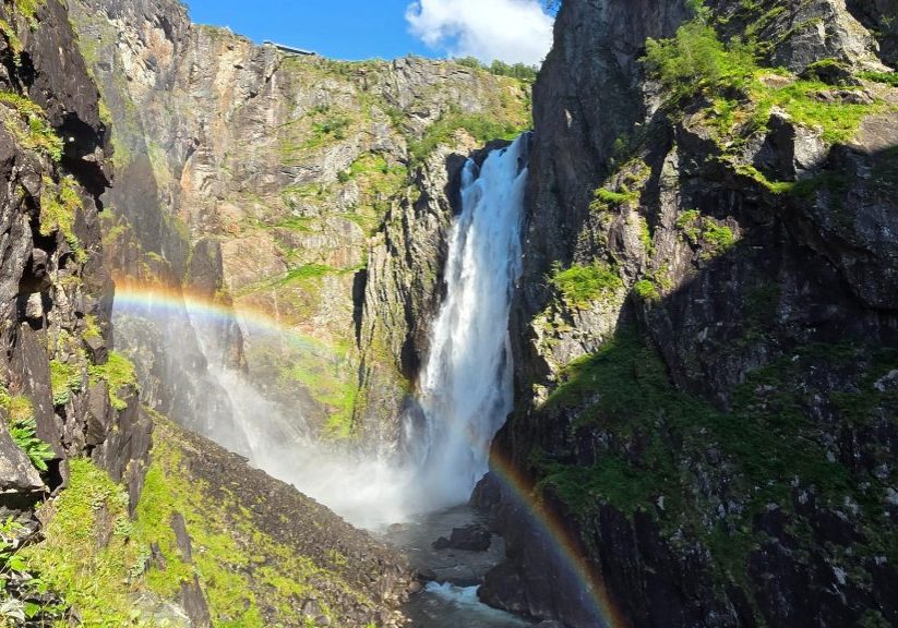 Vøringsfossen waterfall from below with rainbow